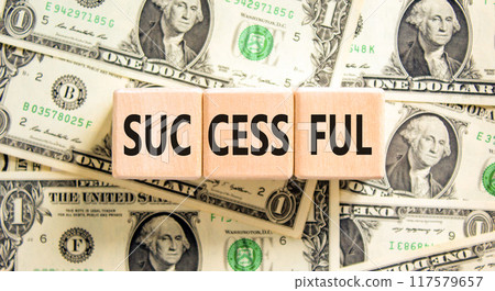 Successful symbol. Concept word Successful on beautiful wooden blocks. Dollar bills. Beautiful background from dollar bills. Business successful concept. Copy space. 117579657