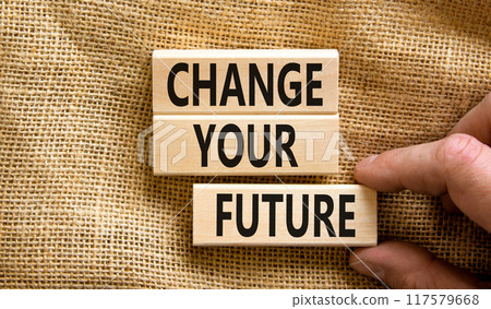 Change your future symbol. Concept words Change your future on wooden blocks on beautiful canvas table canvas background. Businessman hand. Business finacial and change your future concept. Copy space 117579668