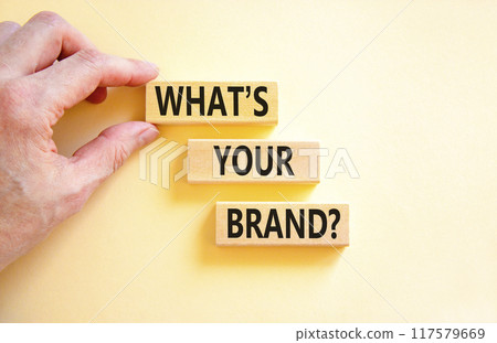Branding and what is your brand symbol. Concept words What is your brand on beautiful blocks. Beautiful white background. Businessman hand. Business branding what is your brand concept. Copy space. Branding and what is your brand symbol. Concept words What is your brand on beautiful blocks. Beautiful white background. Businessman hand. Business branding what is your brand concept. Copy space. 117579669