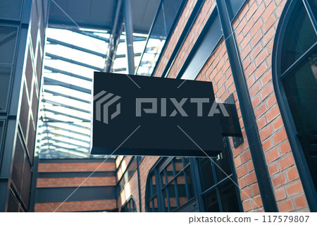 Horizontal side view of empty black signage on business skyscraper with modern architecture 117579807