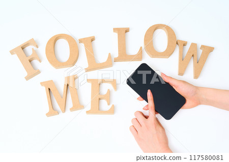 Wooden alphabet blocks arranged with the word "FOLLOW ME" Wooden alphabet blocks arranged with the word "FOLLOW ME" 117580081
