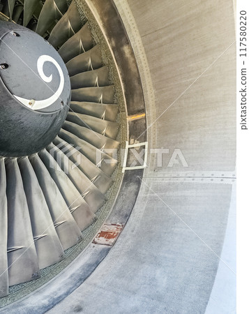Close-up of aircraft engine with blades and cone . High quality photo Close-up of aircraft engine with blades and cone . High quality photo 117580220
