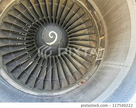 Closeup jet engine blades of airplane. High quality photo Closeup jet engine blades of airplane. High quality photo 117580222