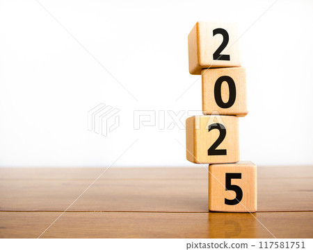 Business concept of 2025 new year symbol. Beautiful turned wooden cube and changed number 2024 to 2025. Beautiful wooden table white background, copy space. Business 2025 happy new year concept. Business concept of 2025 new year symbol. Beautiful turned wooden cube and changed number 2024 to 2025. Beautiful wooden table white background, copy space. Business 2025 happy new year concept. 117581751