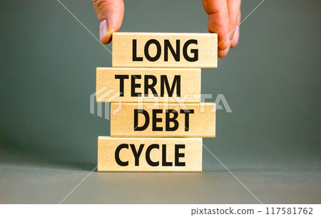 Long term debt cycle symbol. Concept words Long term debt cycle on beautiful wooden block. Beautiful grey table grey background. Businessman hand. Business Long term debt cycle concept. Copy space. 117581762