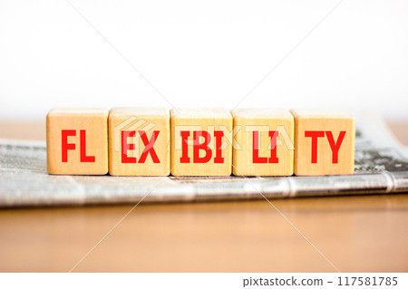 Flexibility symbol. Concept word Flexibility on beautiful wooden blocks. Beautiful wooden table white background. Newspaper. Business flexibility concept. Copy space. Flexibility symbol. Concept word Flexibility on beautiful wooden blocks. Beautiful wooden table white background. Newspaper. Business flexibility concept. Copy space. 117581785