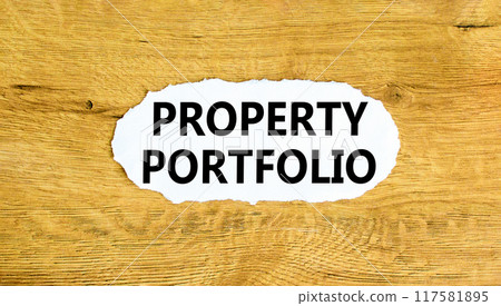 Property portfolio symbol. Concept words Property portfolio on beautiful white paper. Beautiful wooden wall background. Business Property portfolio concept. Copy space. 117581895