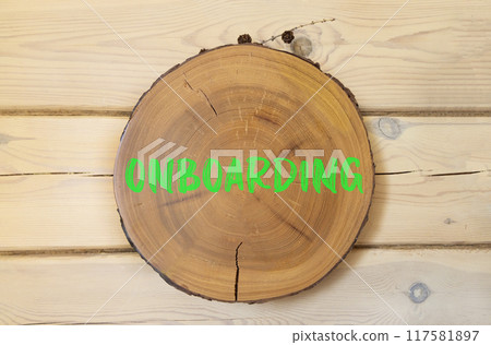 Onboarding success symbol. Concept word Onboarding on beautiful wooden circle. Beautiful wooden wall background. Business onboarding success concept. Copy space. Onboarding success symbol. Concept word Onboarding on beautiful wooden circle. Beautiful wooden wall background. Business onboarding success concept. Copy space. 117581897