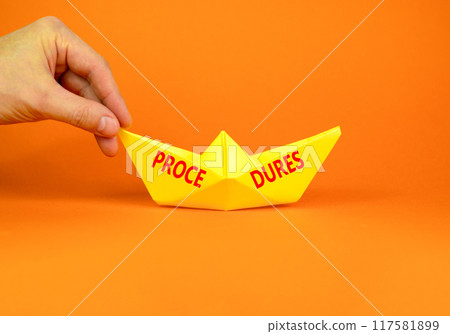 Procedures symbol. Concept word Procedures on beautiful yellow paper boat. Beautiful orange background. Businessman hand. Business procedures concept. Copy space. Procedures symbol. Concept word Procedures on beautiful yellow paper boat. Beautiful orange background. Businessman hand. Business procedures concept. Copy space. 117581899