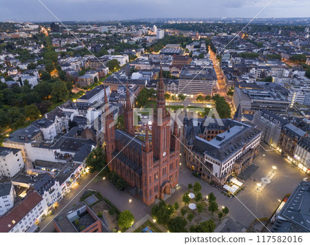Aerial Drone Shot of Cathedral at Marktkirche in Wiesbaden, Germany. Old town and the city center at Evening Twilight. Aerial Drone Shot of Cathedral at Marktkirche in Wiesbaden, Germany. Old town and the city center at Evening Twilight. 117582016