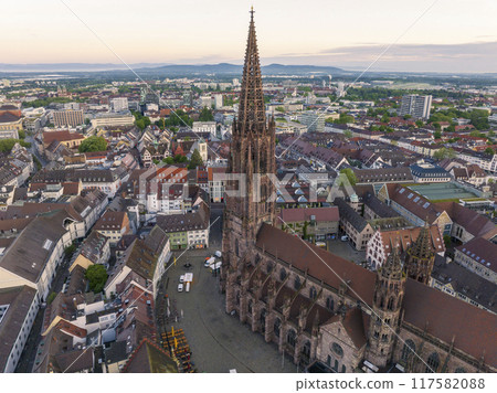 Freiburg im Breisgau, Germany at Sunrise. Aerial Drone Shot on Freiburger Dom Cathedral. 4k Drohne Footage Freiburg im Breisgau, Germany at Sunrise. Aerial Drone Shot on Freiburger Dom Cathedral. 4k Drohne Footage 117582088