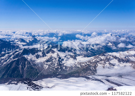view from the top of the mountain, beautiful mountain landscape in blue atmospheric haze view from the top of the mountain, beautiful mountain landscape in blue atmospheric haze 117582122