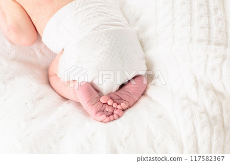 Newborn baby boy in hospital cot 117582367