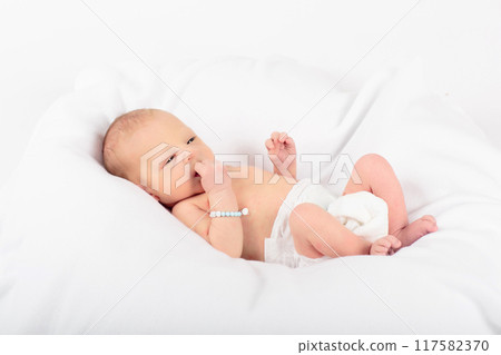 Newborn baby boy in hospital cot 117582370