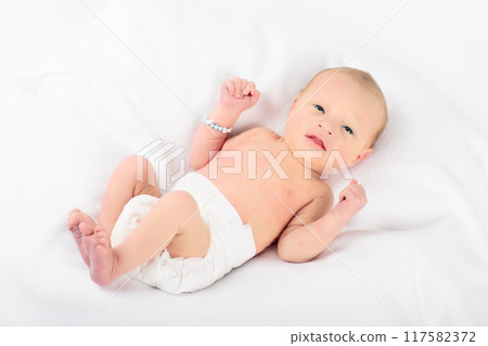 Newborn baby boy in hospital cot 117582372