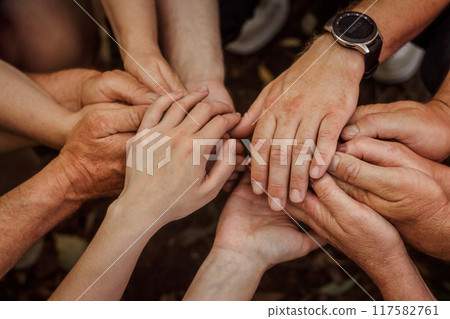 A large family holding hands adult children and elderly parents, support love of loved ones unity. Close-up 117582761
