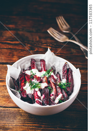 Oven baked beet fries with sour cream and dill Oven baked beet fries with sour cream and dill 117583365