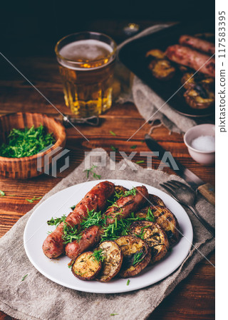 Baked Pork Sausages with Eggplant Slices Baked Pork Sausages with Eggplant Slices 117583395