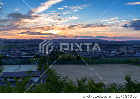 Evening view from Shiroyamadai in Kizugawa City, Kyoto Prefecture. Night view from the sunset on a hill overlooking JR Kizu Station #23 117584016
