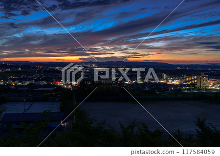 Evening view from Shiroyamadai in Kizugawa City, Kyoto Prefecture. Night view from the sunset on a hill overlooking JR Kizu Station #66 117584059