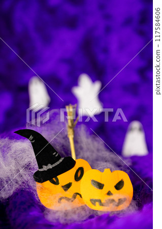 Funny pumpkins dressed as witches on an purple Halloween background. Funny pumpkins dressed as witches on an purple Halloween background. 117584606