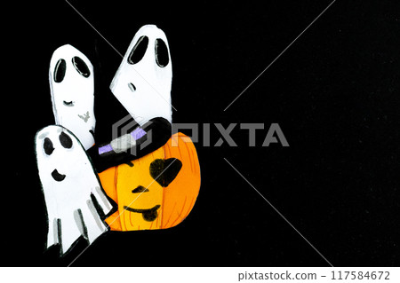 Funny little ghosts and a pumpkin dressed as a witch.Black background card. Funny little ghosts and a pumpkin dressed as a witch.Black background card. 117584672