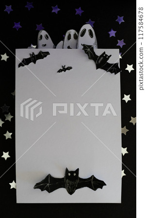 Spooky bats and ghosts peeking out of a white banner. Cards for Halloween Spooky bats and ghosts peeking out of a white banner. Cards for Halloween 117584678