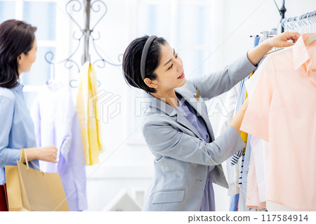 Young woman shopping clerk 117584914