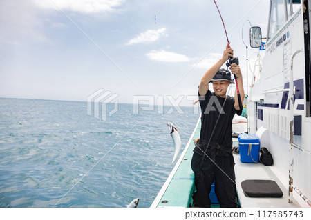 A man enjoying sea fishing A man enjoying sea fishing 117585743