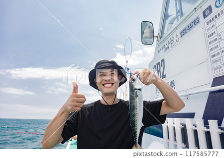 A man enjoying sea fishing 117585777