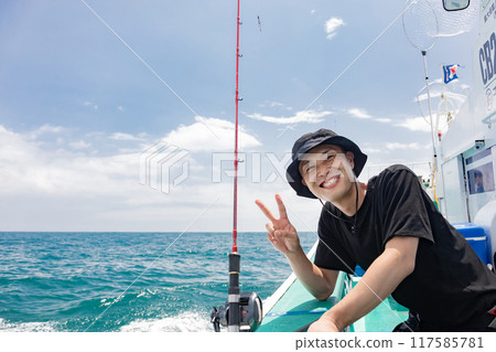 A man enjoying sea fishing A man enjoying sea fishing 117585781