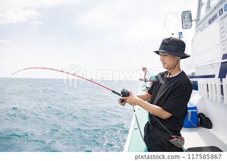 A man enjoying sea fishing 117585867