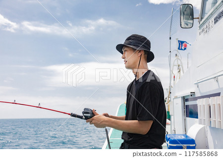 A man enjoying sea fishing 117585868