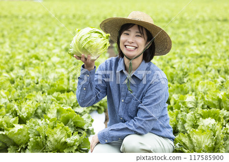 Women with harvested vegetables 117585900