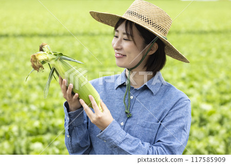 Women with harvested vegetables Women with harvested vegetables 117585909