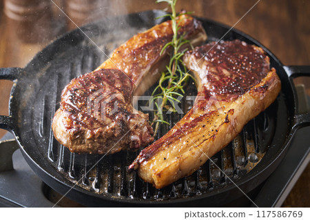 Hokkaido Ezo deer meat grilled on a hot plate Game meat Bone-in loin 117586769