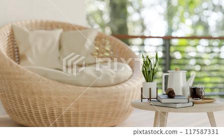 A mini wooden coffee table with objects in a contemporary Scandinavia living room. 117587331
