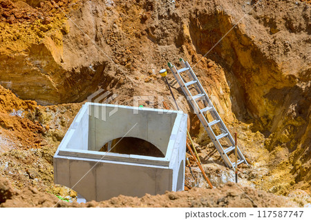 In construction site, drainage concrete collector manhole well sewer system were installed for underground collection of rainwater. In construction site, drainage concrete collector manhole well sewer system were installed for underground collection of rainwater. 117587747