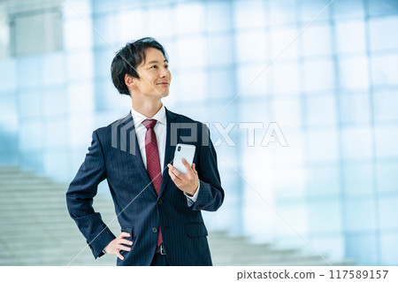 Male businessman in a suit Male businessman in a suit 117589157