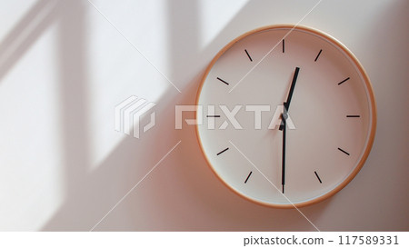 Minimalist Wooden Clock at 00.30/12.30 with Soft Shadows on White Wall - Perfect for Time Management and Lifestyle Branding 117589331