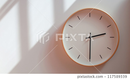 Minimalist Wooden Clock at 14.30/02.30 with Soft Shadows on White Wall - Perfect for Time Management and Lifestyle Branding Minimalist Wooden Clock at 14.30/02.30 with Soft Shadows on White Wall - Perfect for Time Management and Lifestyle Branding 117589339