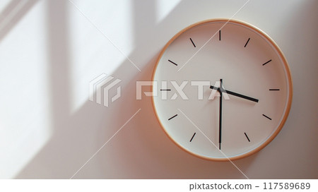 Minimalist Wooden Clock at 15.30/03.30 with Soft Shadows on White Wall - Perfect for Time Management and Lifestyle Branding Minimalist Wooden Clock at 15.30/03.30 with Soft Shadows on White Wall - Perfect for Time Management and Lifestyle Branding 117589689