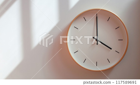 Minimalist Wooden Clock at 16.00/04.00 with Soft Shadows on White Wall - Perfect for Time Management and Lifestyle Branding Minimalist Wooden Clock at 16.00/04.00 with Soft Shadows on White Wall - Perfect for Time Management and Lifestyle Branding 117589691