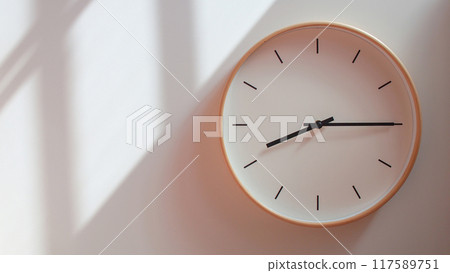 Minimalist Wooden Clock at 20.15/08.15 with Soft Shadows on White Wall - Perfect for Time Management and Lifestyle Branding Minimalist Wooden Clock at 20.15/08.15 with Soft Shadows on White Wall - Perfect for Time Management and Lifestyle Branding 117589751