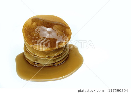 A stack of pancakes with syrup on top 117590294