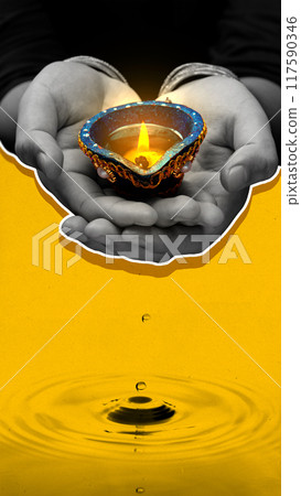A hand holding a candle in a blue and yellow background A hand holding a candle in a blue and yellow background 117590346