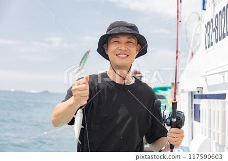 A man enjoying sea fishing 117590603