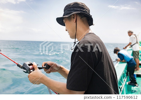 A man enjoying sea fishing 117590612