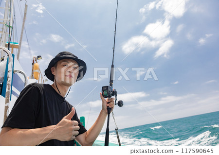 A man enjoying sea fishing 117590645
