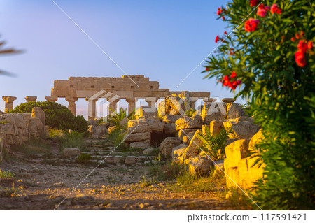 Ancient ruins in the sunset 117591421